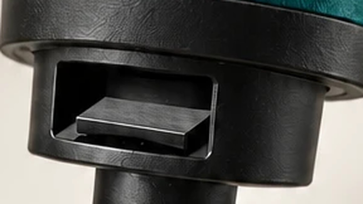 The bottle opener slot built into the black mounting head